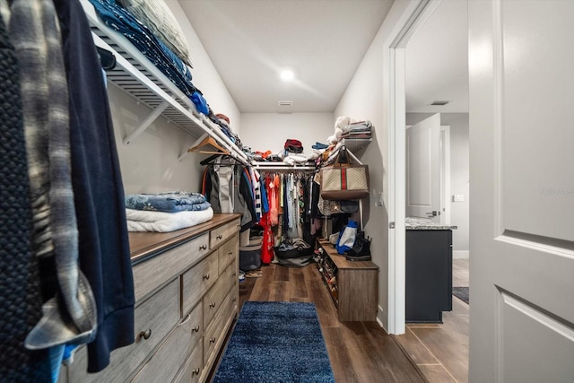2516 Cobalt Shores Ln, Clearwater, FL 33761 - walk in closet with dark wood-style floors