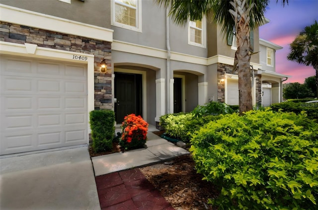 10409 Orchid Mist Ct, Riverview, FL 33578 - view of front facade with stone siding and stucco siding