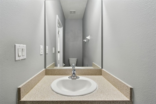 10409 Orchid Mist Ct, Riverview, FL 33578 - bathroom featuring a textured wall and vanity