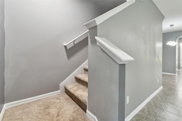 10409 Orchid Mist Ct, Riverview, FL 33578 - stairs featuring tile patterned floors and a chandelier