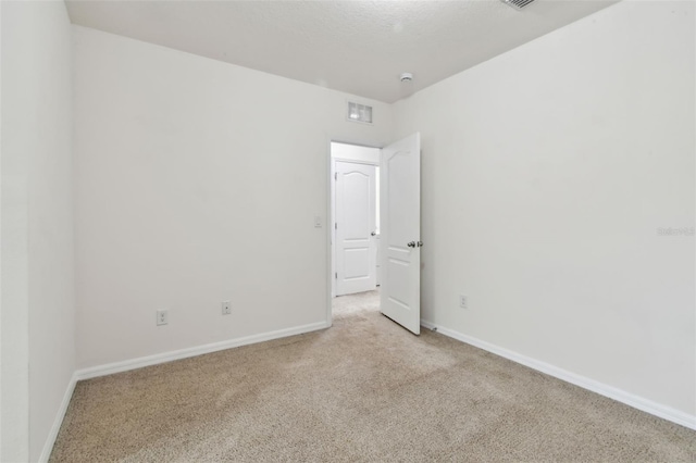 10409 Orchid Mist Ct, Riverview, FL 33578 - unfurnished room with light carpet and a smoke detector