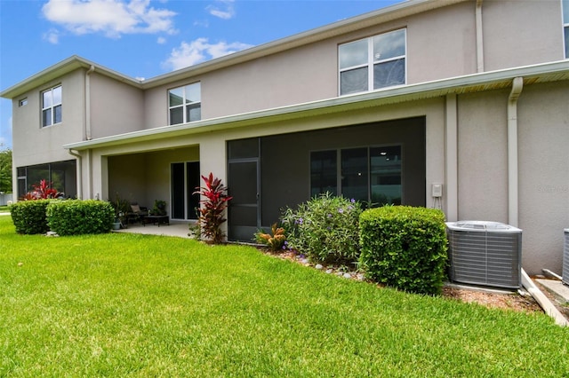 10409 Orchid Mist Ct, Riverview, FL 33578 - back of property with stucco siding and a lawn
