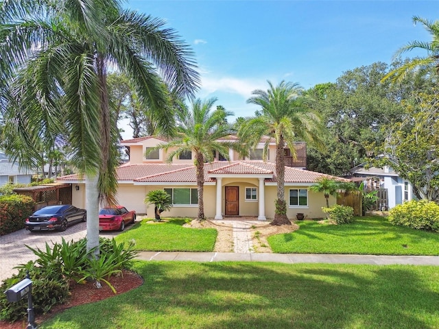 1020 Charles St, Clearwater, FL 33755 - mediterranean / spanish-style home with a tiled roof, stucco siding, driveway, and a front yard