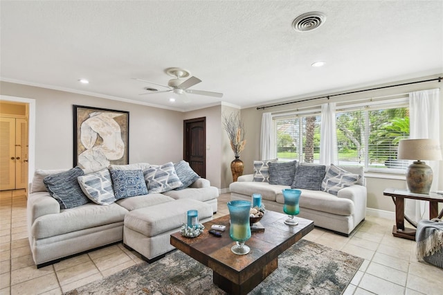 1020 Charles St, Clearwater, FL 33755 - living room with light tile patterned flooring, a ceiling fan, crown molding, recessed lighting, and a textured ceiling