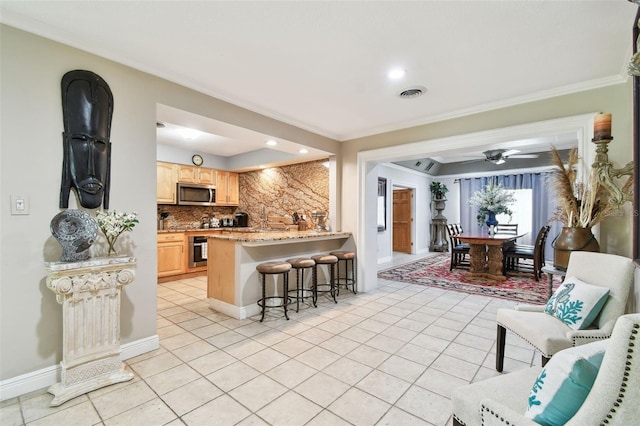 1020 Charles St, Clearwater, FL 33755 - living room featuring ornamental molding, light tile patterned floors, ceiling fan, and recessed lighting