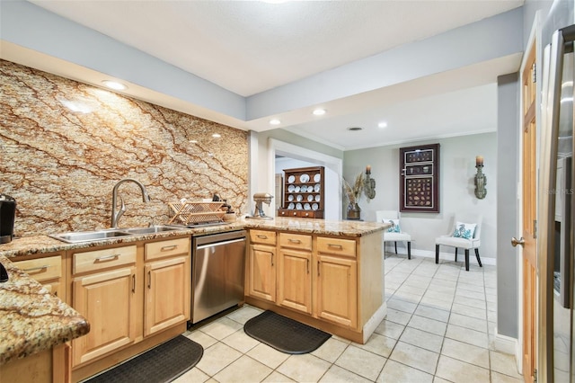 1020 Charles St, Clearwater, FL 33755 - kitchen with a peninsula, stainless steel appliances, light tile patterned floors, light stone counters, and recessed lighting