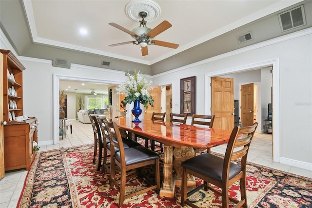 1020 Charles St, Clearwater, FL 33755 - dining area featuring ceiling fan, light tile patterned floors, and crown molding