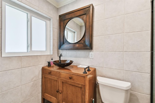1020 Charles St, Clearwater, FL 33755 - bathroom with tile walls, vanity, and ornamental molding