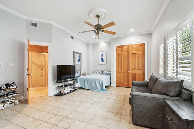 1020 Charles St, Clearwater, FL 33755 - bedroom with crown molding, light tile patterned flooring, a closet, recessed lighting, and a ceiling fan
