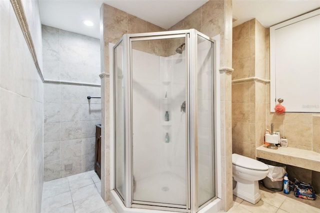 1020 Charles St, Clearwater, FL 33755 - full bath featuring tile walls, a shower stall, and tile patterned floors