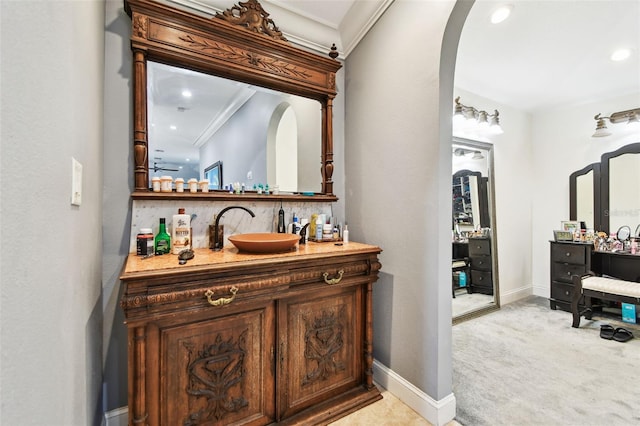 1020 Charles St, Clearwater, FL 33755 - indoor dry bar with light colored carpet, arched walkways, ornamental molding, and recessed lighting