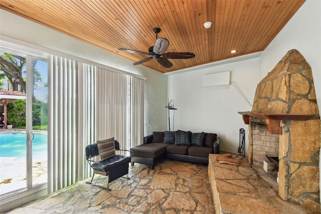 1020 Charles St, Clearwater, FL 33755 - living area featuring wood ceiling, ceiling fan, stone finish flooring, and a wall mounted AC
