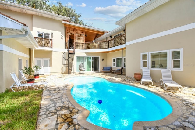 1020 Charles St, Clearwater, FL 33755 - outdoor pool with stairway, a patio, and french doors