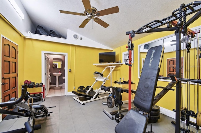 1020 Charles St, Clearwater, FL 33755 - exercise room featuring vaulted ceiling, ceiling fan, and a textured ceiling