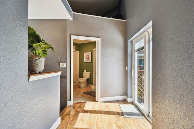 1020 Charles St, Clearwater, FL 33755 - hallway with wood finished floors and a textured wall