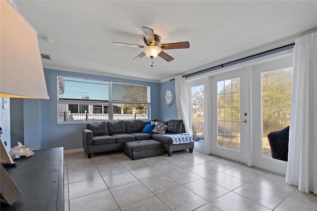 3823 Sail Dr, New Port Richey, FL 34652 - living room featuring ceiling fan, healthy amount of natural light, and light tile patterned flooring
