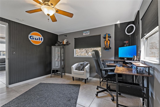 3823 Sail Dr, New Port Richey, FL 34652 - tiled home office featuring an accent wall, ornamental molding, and a ceiling fan