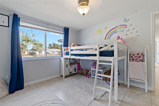 3823 Sail Dr, New Port Richey, FL 34652 - bedroom featuring tile patterned flooring and a textured ceiling