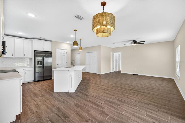 5413 Badini Way, Palmetto, FL 34221 - kitchen featuring stainless steel fridge with ice dispenser, ceiling fan, light countertops, decorative light fixtures, and decorative backsplash