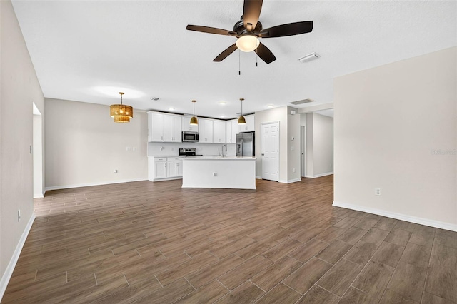 5413 Badini Way, Palmetto, FL 34221 - unfurnished living room featuring a ceiling fan, dark wood-style floors, and recessed lighting