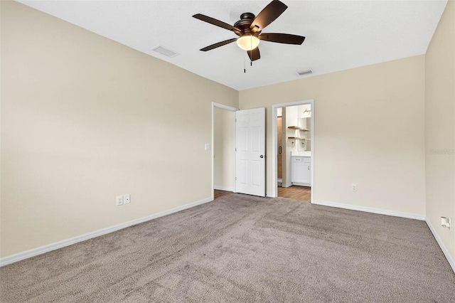 5413 Badini Way, Palmetto, FL 34221 - unfurnished bedroom featuring carpet floors, connected bathroom, and ceiling fan