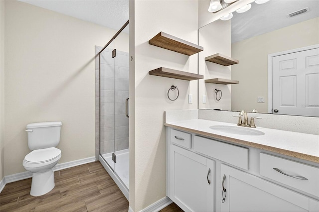 5413 Badini Way, Palmetto, FL 34221 - bathroom with vanity, a stall shower, and wood finished floors