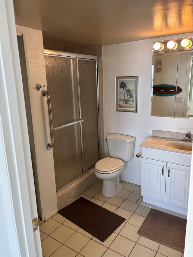 7401 Bay Island Dr S Unit 338, South Pasadena, FL 33707 - full bath featuring vanity, tile patterned flooring, and a stall shower
