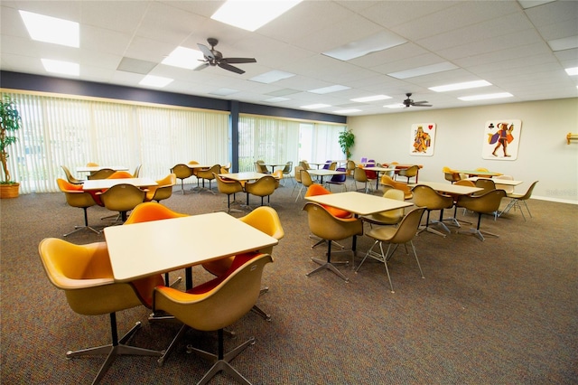 7401 Bay Island Dr S Unit 338, South Pasadena, FL 33707 - carpeted dining room with a paneled ceiling and a ceiling fan