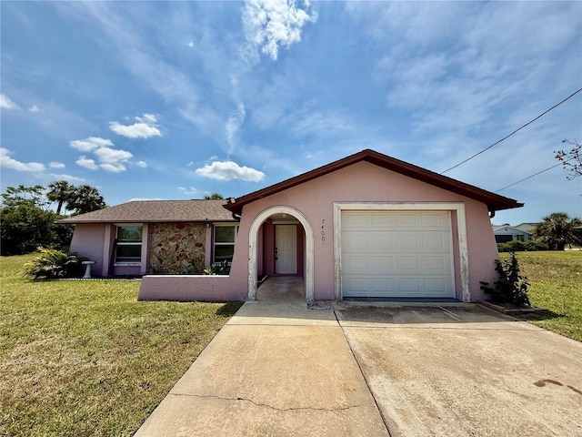 7400 Mako Dr, Hudson, FL 34667 - ranch-style home featuring driveway, stucco siding, and a front lawn