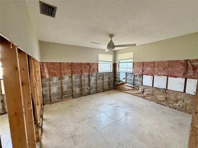 7400 Mako Dr, Hudson, FL 34667 - spare room with ceiling fan and a textured ceiling