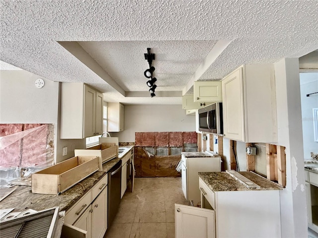 7400 Mako Dr, Hudson, FL 34667 - kitchen with a textured ceiling, appliances with stainless steel finishes, and rail lighting