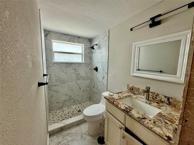 7400 Mako Dr, Hudson, FL 34667 - full bath with marble look tiles, vanity, a shower stall, and a textured ceiling