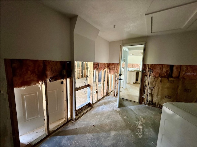 7400 Mako Dr, Hudson, FL 34667 - misc room with unfinished concrete floors and washer / dryer