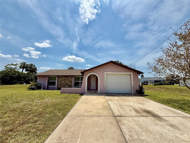 7400 Mako Dr, Hudson, FL 34667 - single story home with driveway, stucco siding, an attached garage, and a front lawn