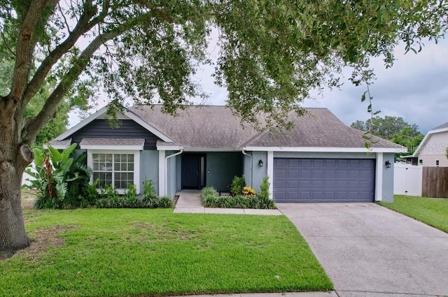 2049 Darlington Oak Dr, Seffner, FL 33584 - ranch-style home with stucco siding, concrete driveway, a garage, and roof with shingles
