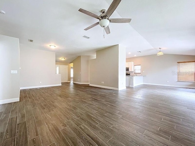 2049 Darlington Oak Dr, Seffner, FL 33584 - unfurnished living room with lofted ceiling, ceiling fan, and dark wood-style floors