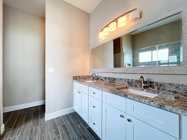 2049 Darlington Oak Dr, Seffner, FL 33584 - bathroom featuring double vanity and wood tiled floors