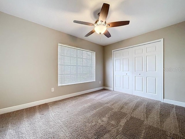 2049 Darlington Oak Dr, Seffner, FL 33584 - unfurnished bedroom featuring carpet floors, a closet, and ceiling fan