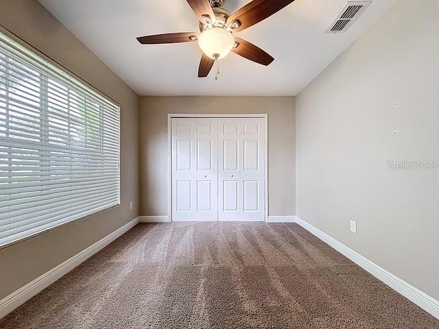 2049 Darlington Oak Dr, Seffner, FL 33584 - unfurnished bedroom featuring carpet flooring, a closet, and a ceiling fan