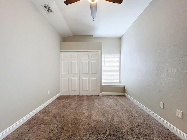 2049 Darlington Oak Dr, Seffner, FL 33584 - unfurnished bedroom featuring vaulted ceiling, carpet, a closet, and ceiling fan