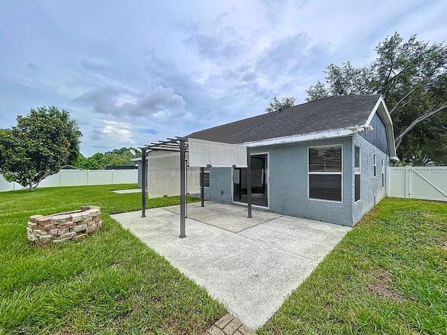 2049 Darlington Oak Dr, Seffner, FL 33584 - back of property with a fire pit, a patio area, a fenced backyard, a pergola, and roof with shingles