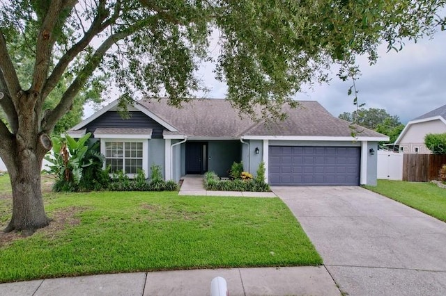 2049 Darlington Oak Dr, Seffner, FL 33584 - ranch-style home with stucco siding, a garage, driveway, and roof with shingles