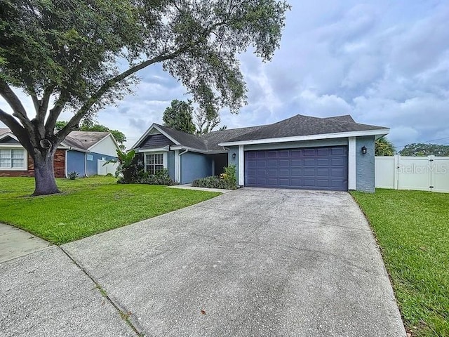 2049 Darlington Oak Dr, Seffner, FL 33584 - ranch-style home featuring concrete driveway, an attached garage, a gate, and stucco siding