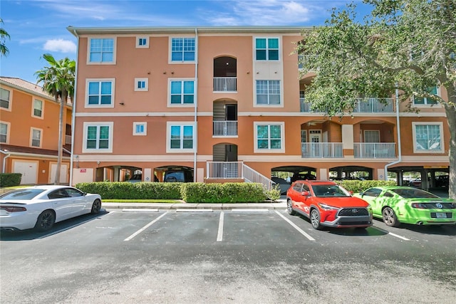 5000 Culbreath Key Way Unit 8-106, Tampa, FL 33611 - view of property featuring uncovered parking