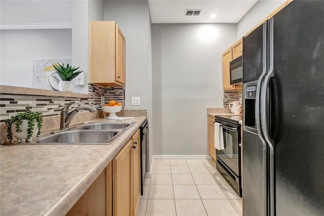 5000 Culbreath Key Way Unit 8-106, Tampa, FL 33611 - kitchen with black appliances, decorative backsplash, light countertops, light brown cabinetry, and light tile patterned flooring