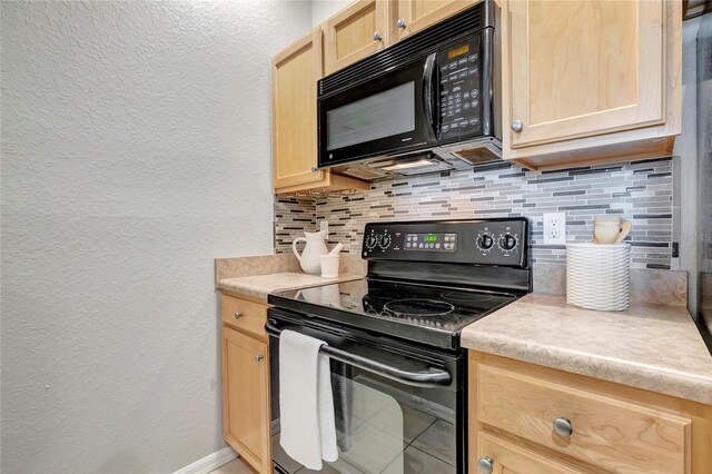 5000 Culbreath Key Way Unit 8-106, Tampa, FL 33611 - kitchen featuring black appliances, a textured wall, light brown cabinetry, decorative backsplash, and light countertops