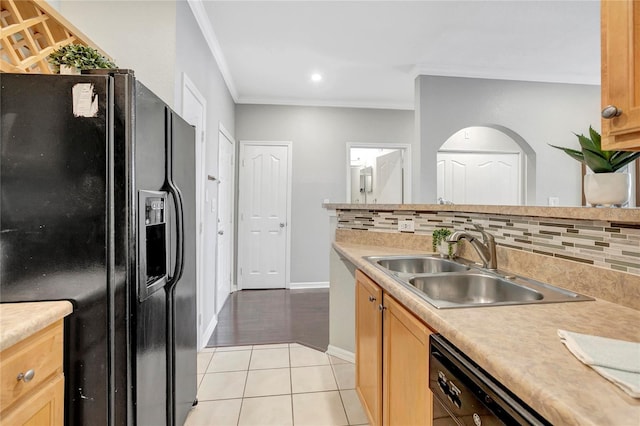 5000 Culbreath Key Way Unit 8-106, Tampa, FL 33611 - kitchen featuring black appliances, light tile patterned flooring, ornamental molding, light countertops, and decorative backsplash