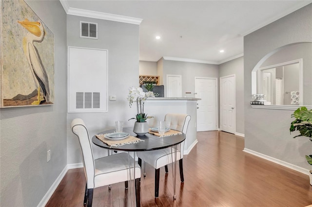 5000 Culbreath Key Way Unit 8-106, Tampa, FL 33611 - dining area featuring wood finished floors, ornamental molding, and recessed lighting