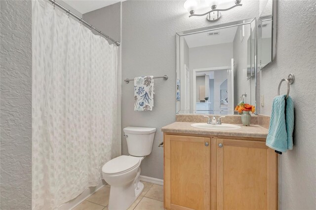 5000 Culbreath Key Way Unit 8-106, Tampa, FL 33611 - bathroom with tile patterned floors, vanity, a textured wall, and a shower with shower curtain
