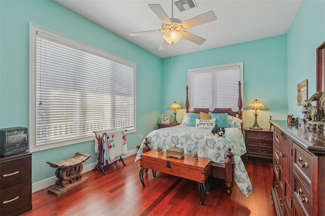5521 Windward Way, New Port Richey, FL 34652 - bedroom with multiple windows, dark wood-type flooring, and ceiling fan